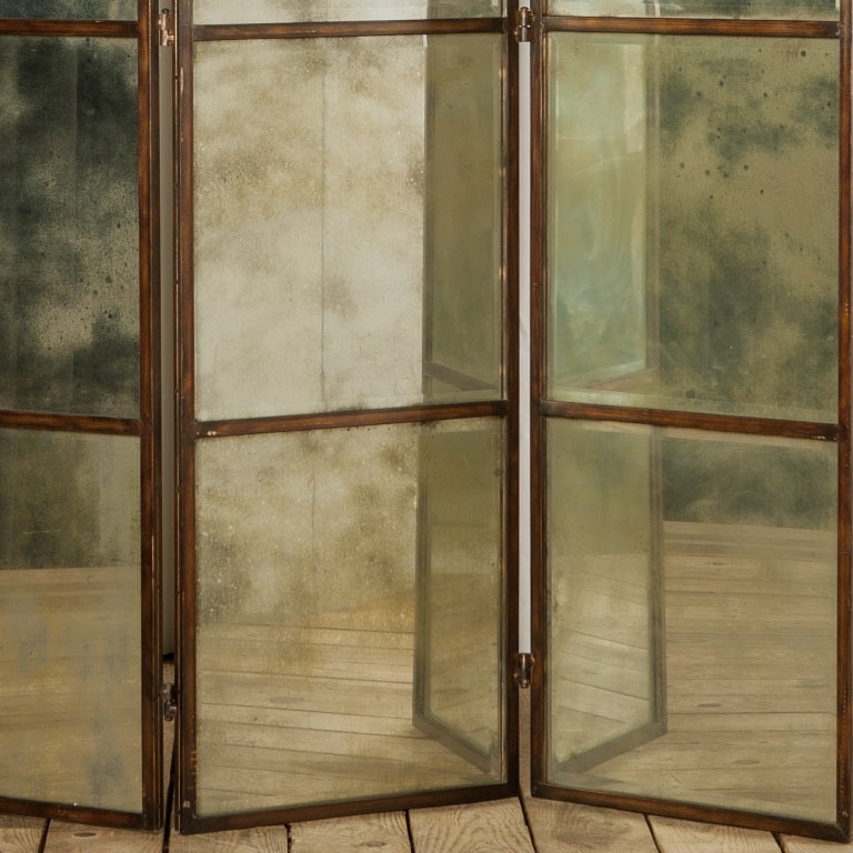 Beautiful mercurised triptique mirror screen with the most incredible patina in a bronzed finish frame