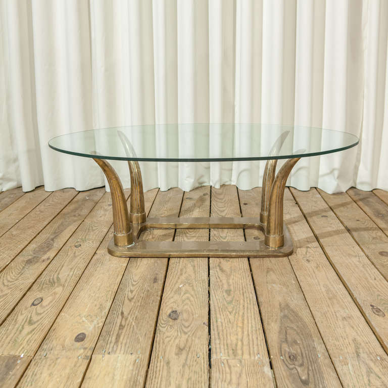 A Brass Horn Coffee Table with Glass Top