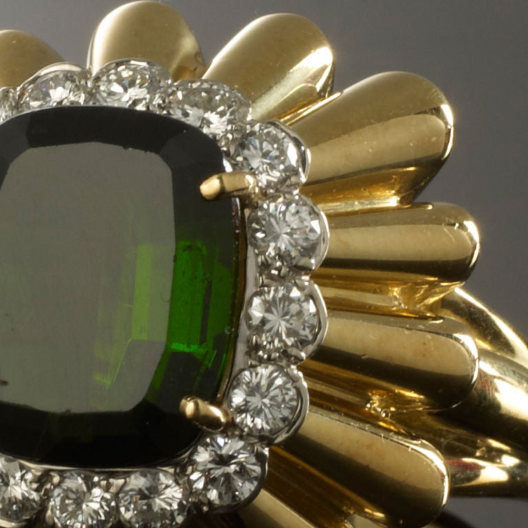 A irreplacable piece of jewellery. <br />
This stunning ring has a large Tourmaline stone in the centre with a diamond surround. Sits extremely proud from the finger for a dramatic presence.
