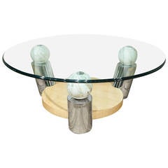 A Circular Glass Coffee Table with Wood and Marble Detail