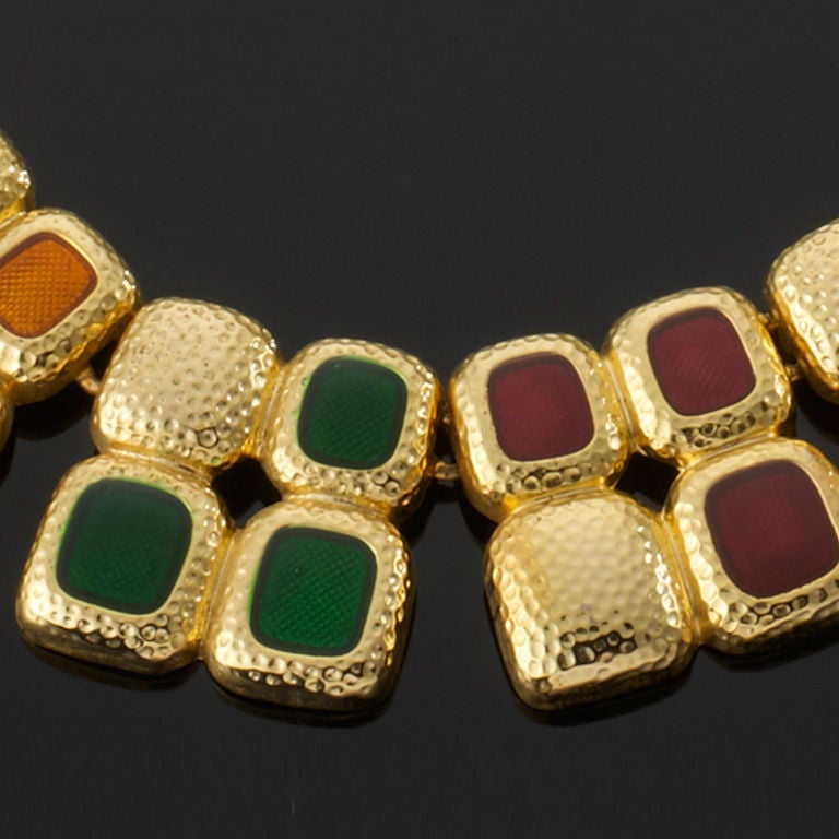 This choker is made up of flat oblongs of poured glass in a wonderful array of colours surrounded by shiny gold tone metal