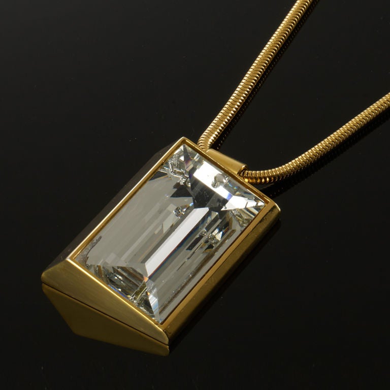 A stunning modernist piece of jewellery made up of a huge single Glass stone on a rolled necklace
Signed on the back of pendant
