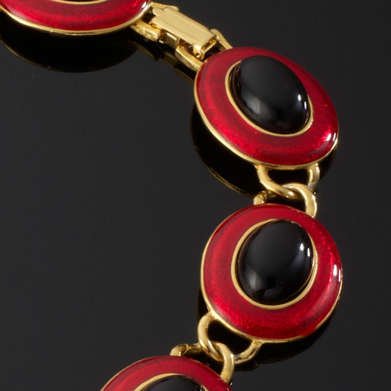 A 1970's Red and Black enamel disc necklace with Gold tone surround.
