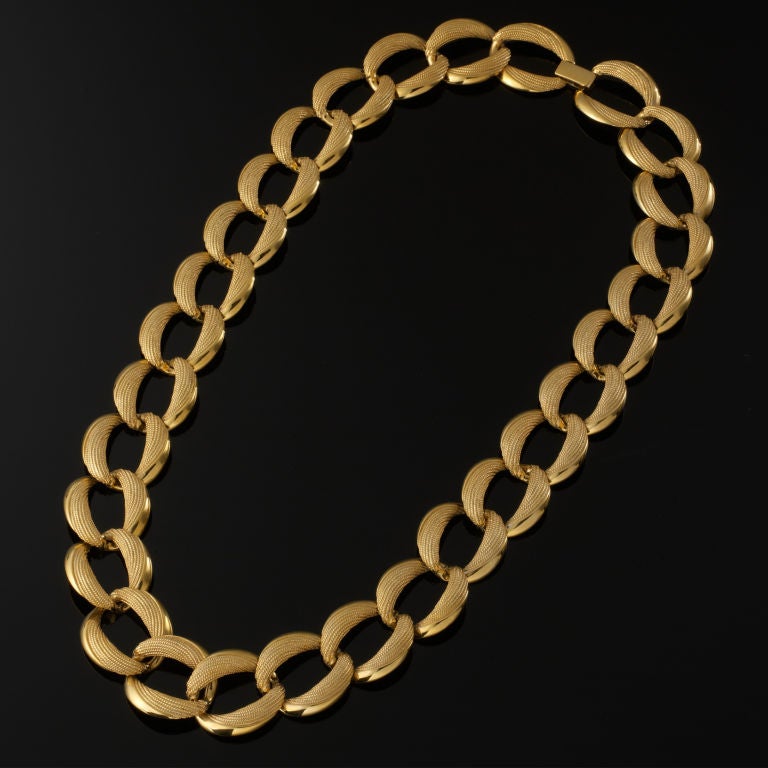 A bold Napier piece made up of Gold tone metal textured links. Stunning on!