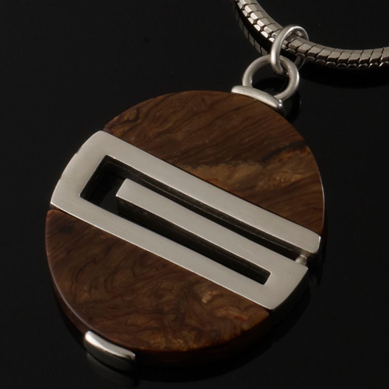 This is a stunning piece by Givenchy, a wooden G pendant on a rope chain necklace. Givenchy G on clasp