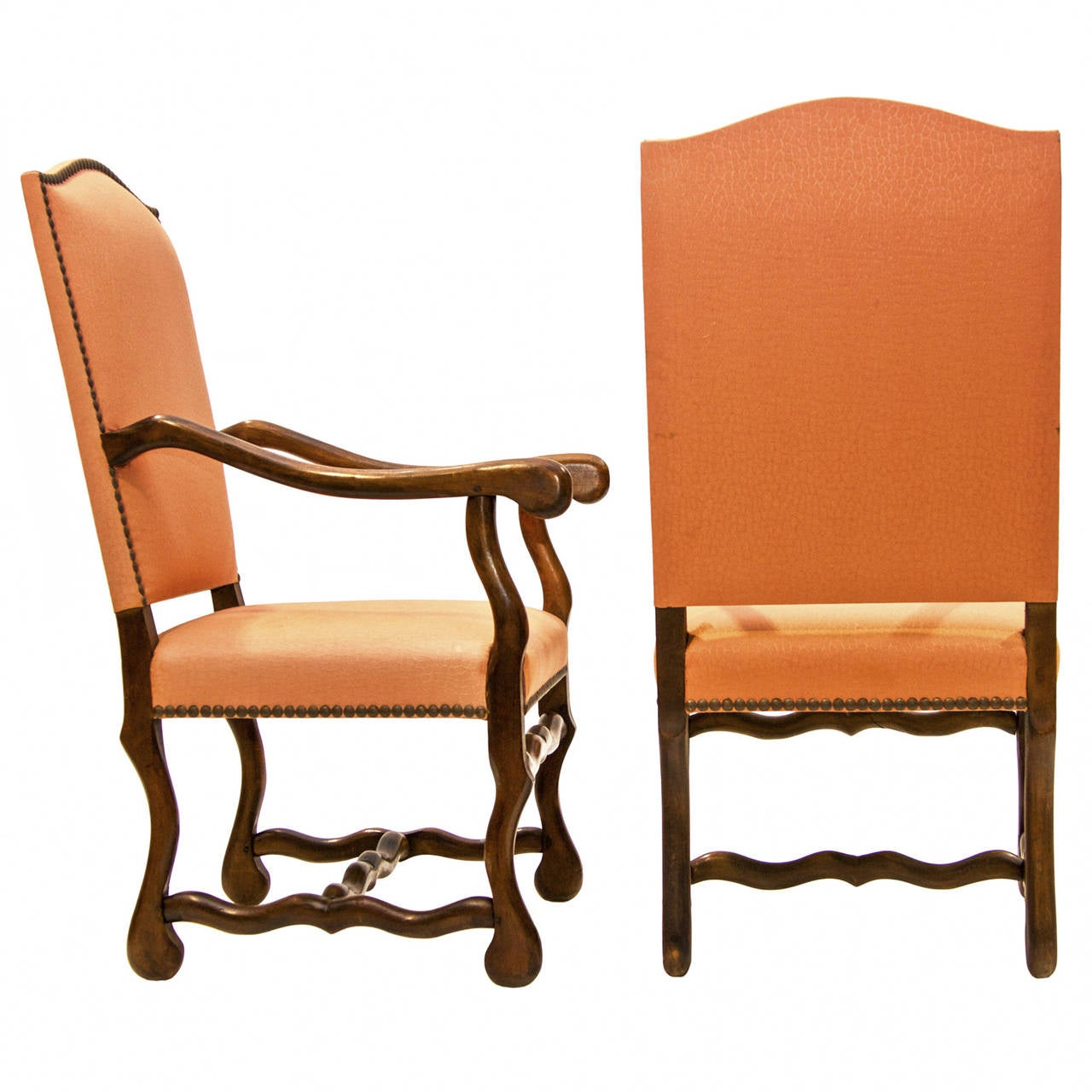 A fine and sturdy yet simple pair of Louis XIV style armchairs in the 