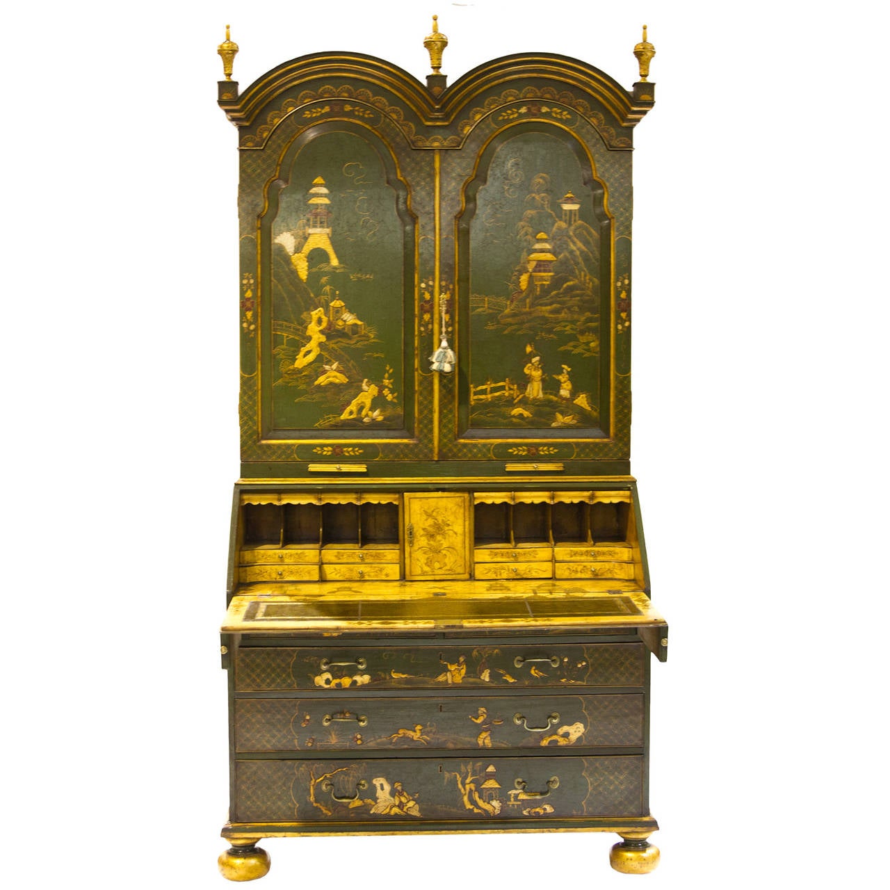 This is a rare Queen Anne double-dome top green and brown chinoiserie lacquered secretaire with fitted interior. Wonderful decoration adorns this piece inside and out. Flip-top desk secretaire with beautiful yellow color ground and gilt painted