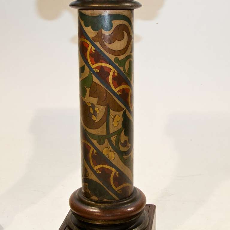 19th Century Pair of Continental Stands in a Polychrome Painted Finish. Wonderful detail adorns the stands and a unique painted finish. Acanthus leaf carvings and scroll corners finish the detail of the pair of columns.