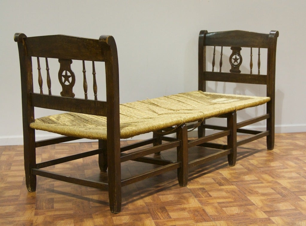A fantastic rustic french daybed. Having a rush seating area. Very sturdy and nice patina.