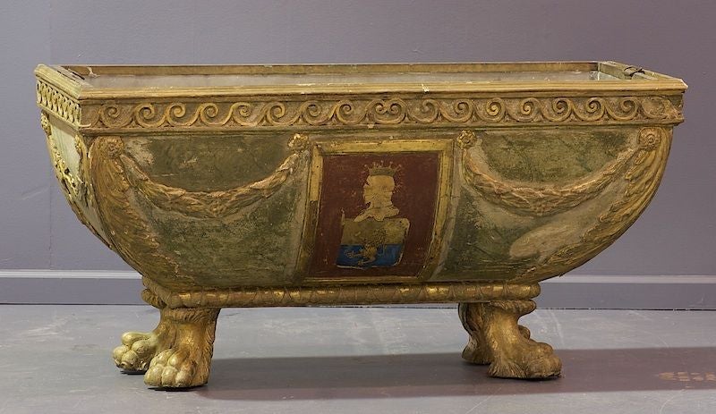 An outstanding Italian painted cassone from Florence, Italy. NOTE This was originally a cassone having a top lid. It was converted at a later date to a planter. There was damage to the lid. The painting applied to the piece is amazing with a center