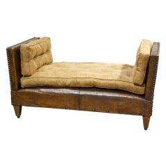 A Vintage Leather and Suade Bench Adjusting to a daybed