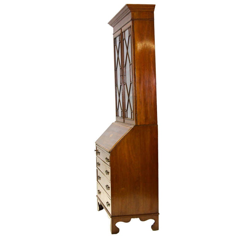 A fine Sheraton mahogany inlaid bureau bookcase in mahogany. Each piece of glass is beveled showing the quality of the piece. Circa date 1920.

36″ wide x 19″ deep x 85″ tall