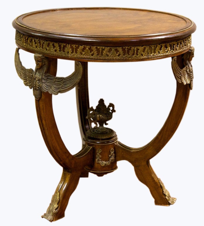 A very nice french Empire round occasional table with bronze mounting and a burl walnut top. Very good quality table.