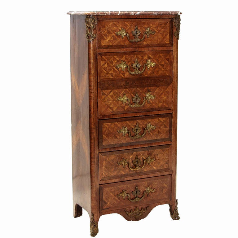 A Fine Régence Kingwood small secrétaire à abattant with a marble top. The fall front secrétaire with fitted interior and leather writing surface. There are four drawers and rococo style pulls and escutcheons. Strong gilt mounts to the sides, front