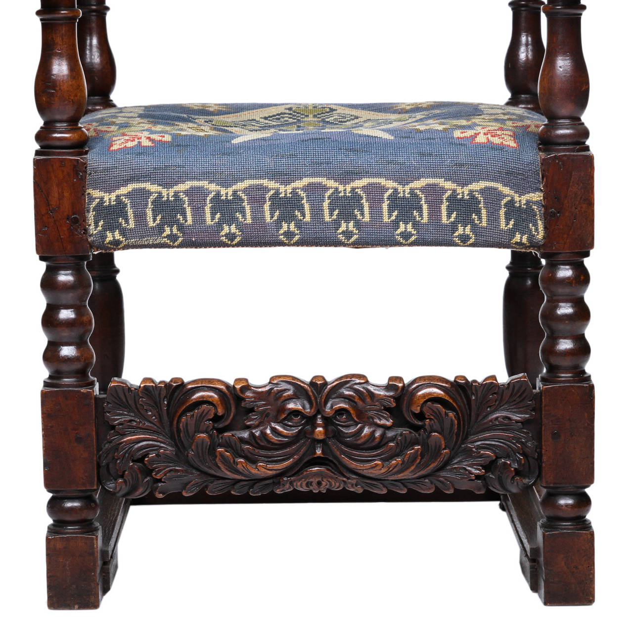 An Early 19th Century French Arm Chair with the Mistral Wind Mask

A highly carved high back and stout french armchair with tapestry coverings. The back panel has a wonderful carved coat of arms and the mistral wind mask above. The post are top