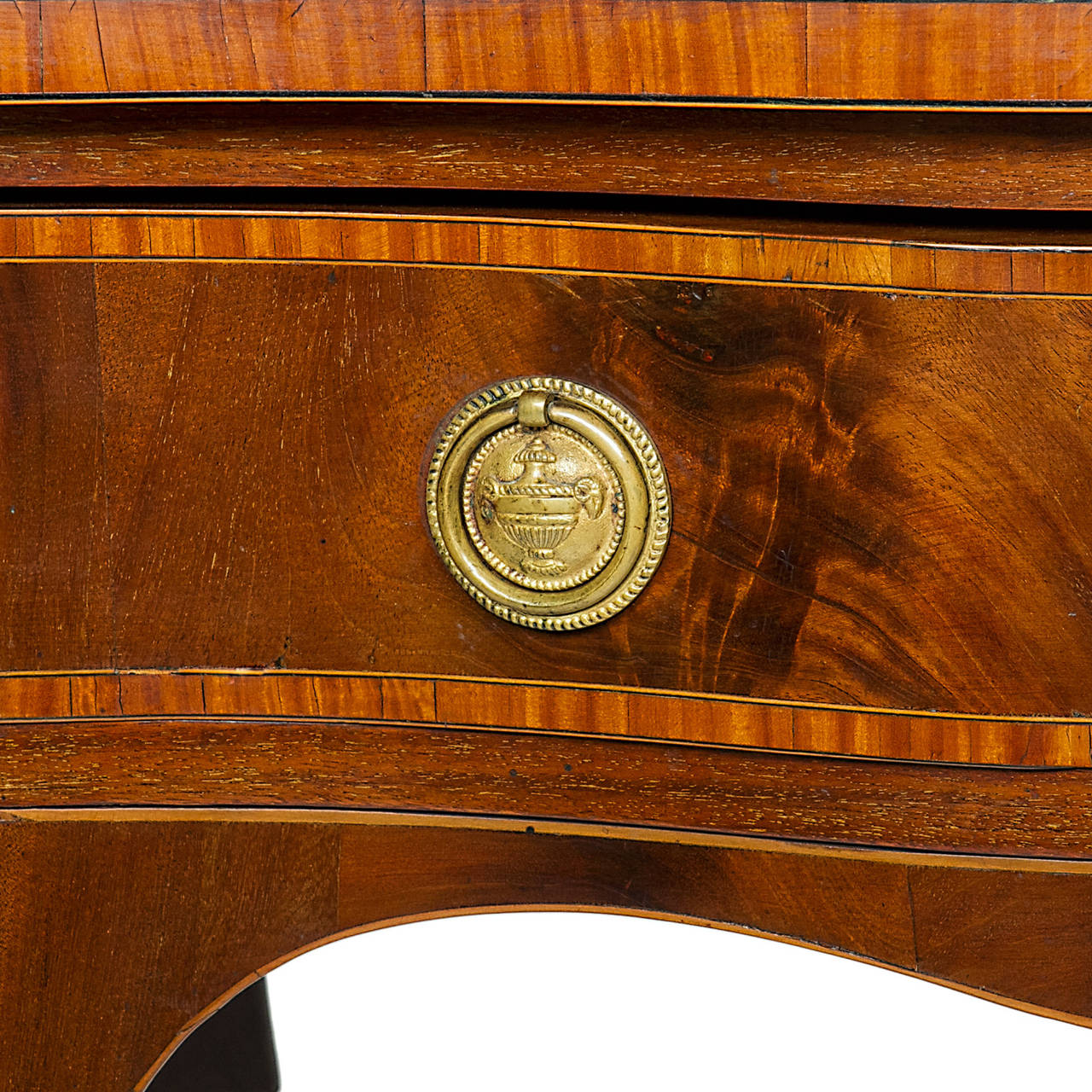 19th Century Sheraton Inlaid Serpentine Front Sideboard

Here is a very nice English Sheraton Mahogany inlaid sideboard from an estate in Charleston, SC. Wonderful patina and color. There are there drawers and one side with cabinet. The sideboard