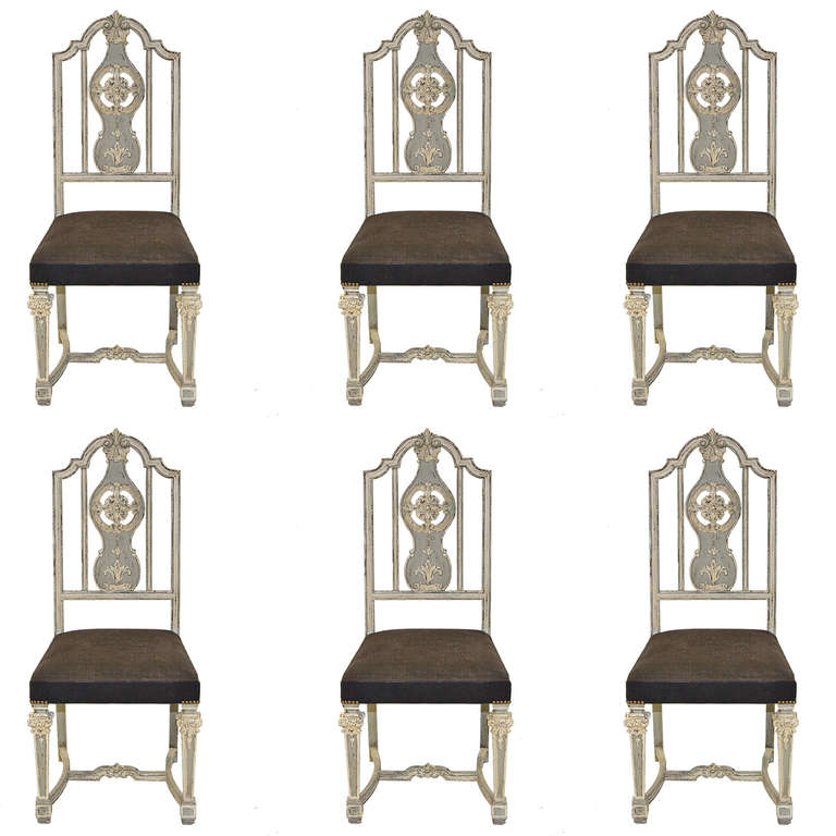 A spectacular set of six french painted side chairs. Wonderful painted finish and linen covered seats. Superb carvings. They speak for themselves.