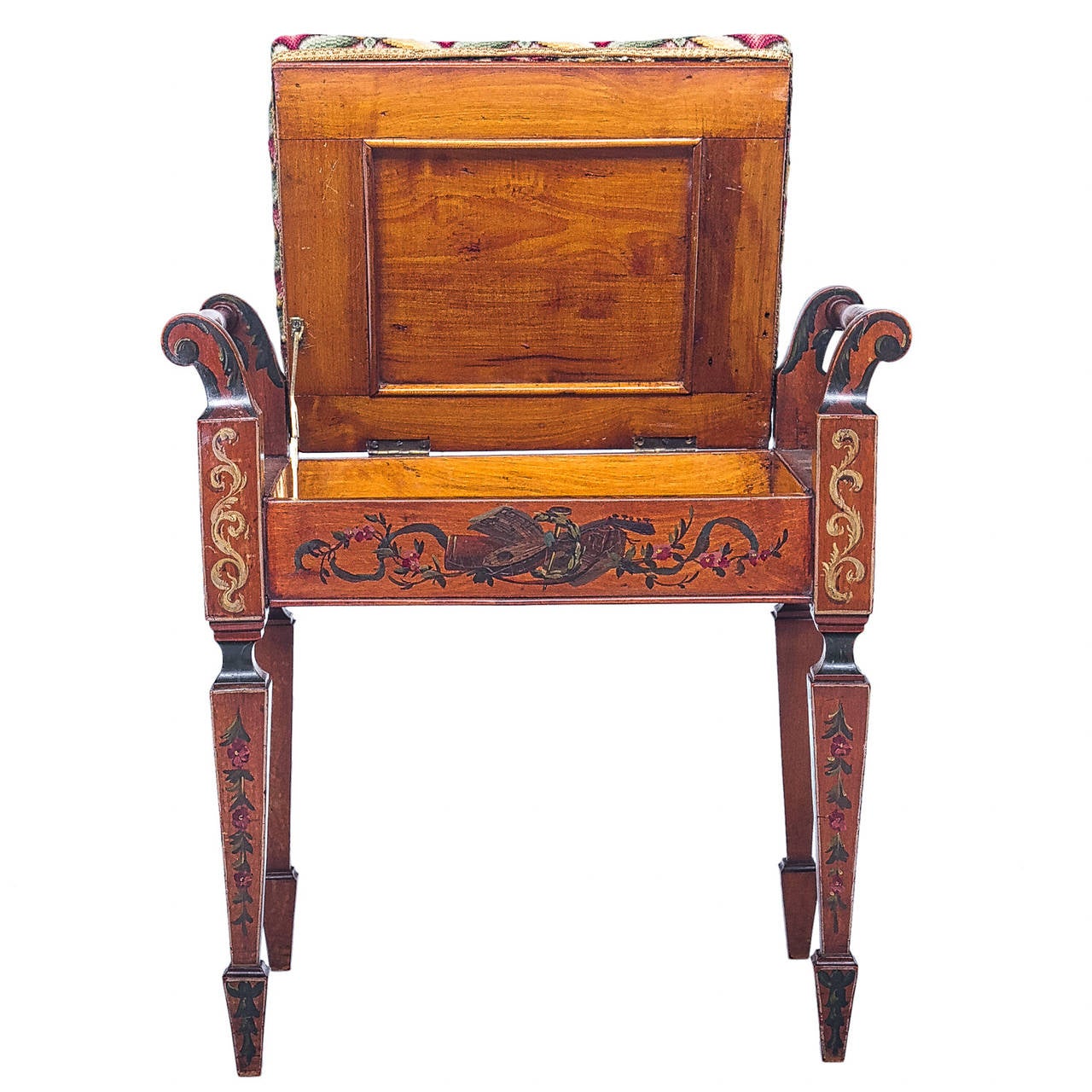 A fine and elegant satinwood bench with a lift seat. This bench has been hand-painted with a trophy design to the front apron, legs with bell flowers, supports with acanthus leaf, and all-over paintings. A striking work of art. There are two rolled