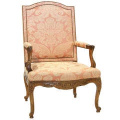 A 19th CENTURY FRENCH WALNUT OPEN ARMCHAIR