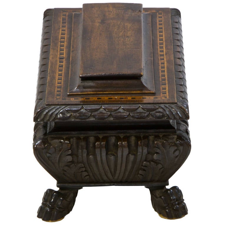 A fantastic Italian keep sake box shaped as a cassone. Made from beautiful patina walnut with inlay on the top. Detailed carvings which emulate an original cassone.