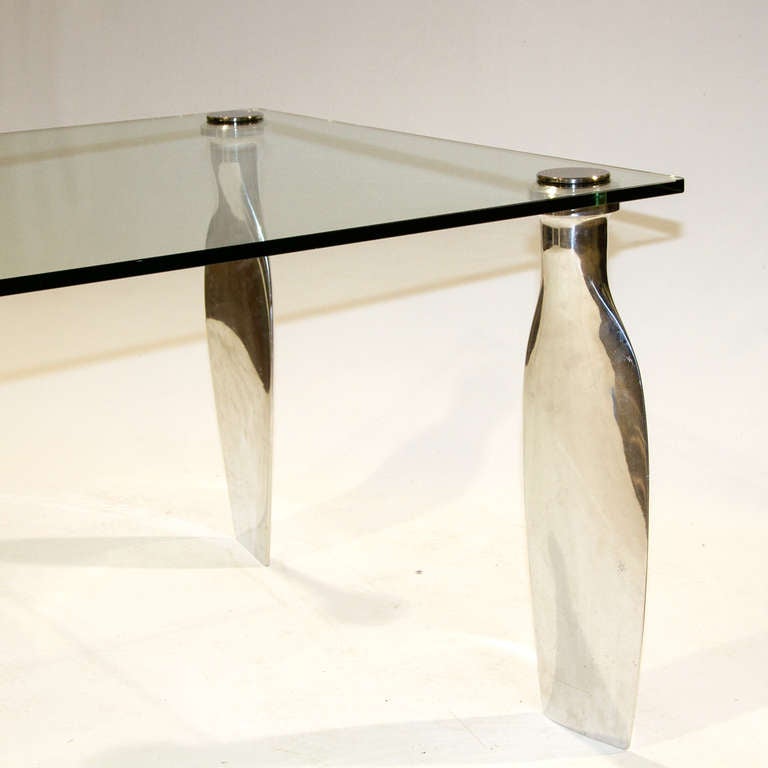 An Exceptional and Unique
Mirror Polished
Aluminum Airplane Propeller Table

Height: 31 ½ in.
Width: 45 in.
Length: 90 in.
Thickness of Glass: ¾ in.