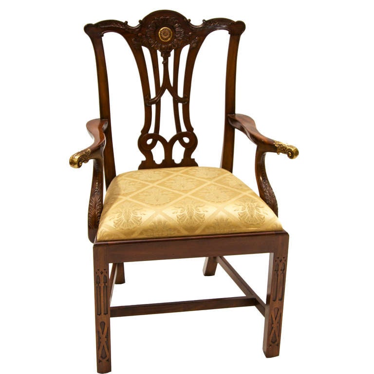 10 Straight Leg Chippendale Mahogany Dining Chairs. 2 Arms and 8 sides. These are a discontinued model from Maitland Smith. Arch back, blind fret work to the legs, brass mounts, well carved, box stretcher, and pierced splat.