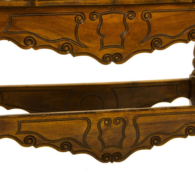 A quality French Provincial Petrin out of walnut. Subtle carvings in Provence style. Lift off top and dovetailed front and backs of the storage bin. Resting on a box style base.