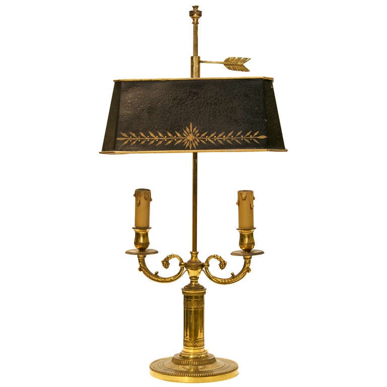 A Pair of 19th Century Two Branch French Empire Bouillotte Lamps. With tole shades rectangular shape and ormolu supports. These were candle equipped and were modified for wiring. They have the original European wiring.