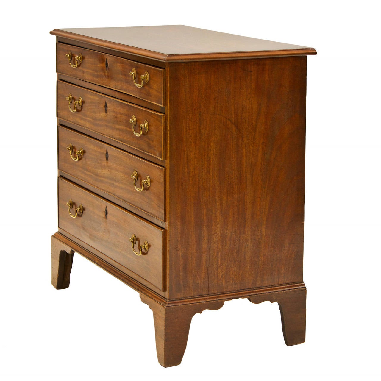 A fine 19th century mahogany chest of graduated drawers. There are four functional drawers with brass hardware. The escutcheons have been replaced due to import laws. These were discarded in Europe by the individual. The chest rest upon bracket