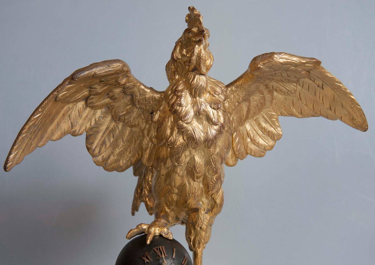 A 19th century French gilt bronze rooster clock with brass eight-day spring driven movement. Newly cleaned and operational.