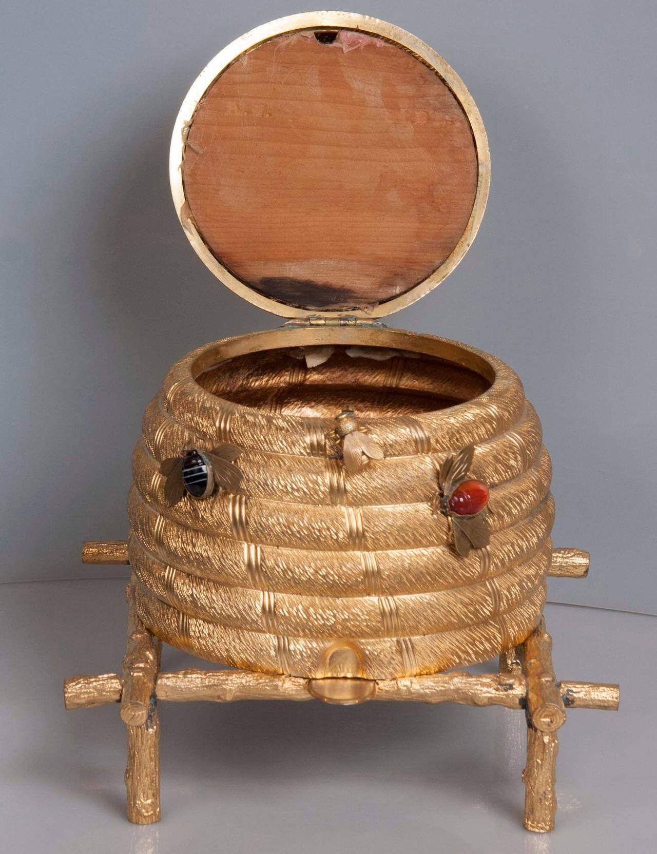 A late 19th-early 20th century English gilt metal work box in the form of a beehive.