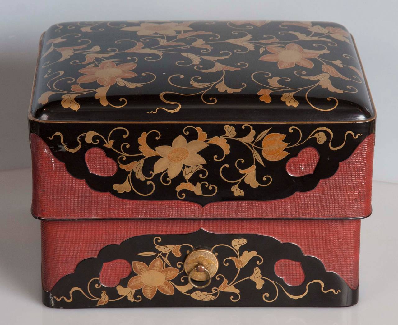 A Japanese Edo period Tebako gold on black lacquer box with vine and floral pattern and overlapping lid.