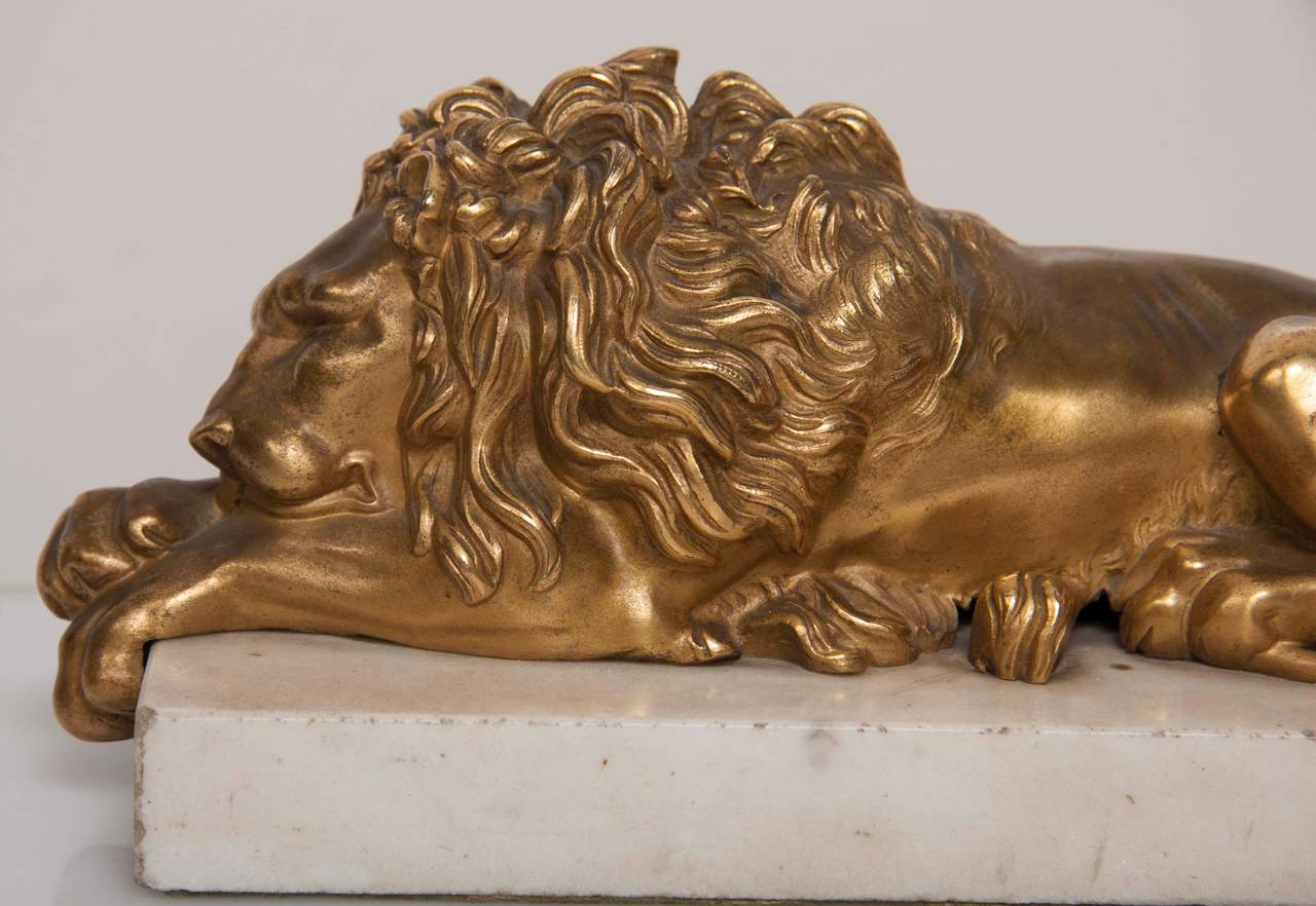 19th Century Gilt and Bronze Recumbent Lion Sculptures