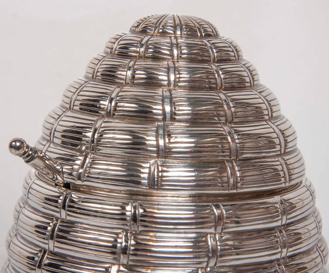 A Tiffany sterling silver honey pot with spoon in beehive form.