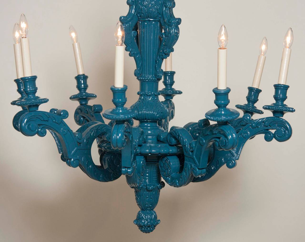 A turn of the century Louis XIV style wooden chandelier, lacquered in blue and rewired.