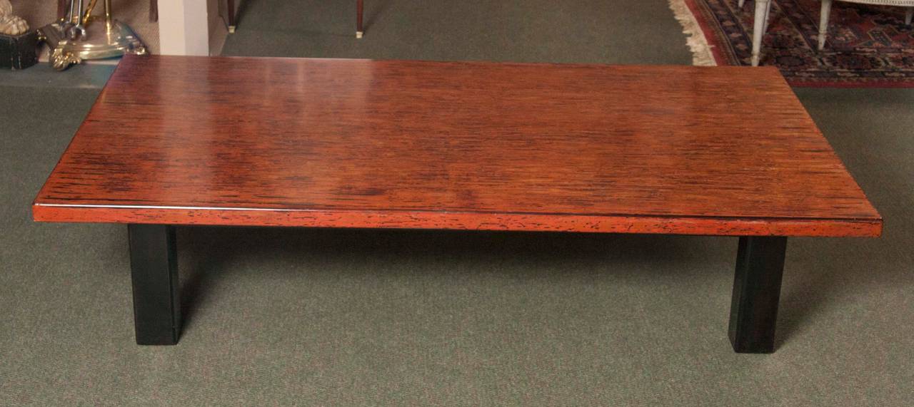A 20th century Japanese lacquered low table.