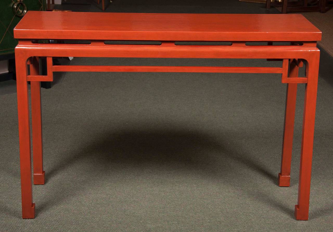 A pair of Chinese red lacquered console tables from the 1940s.