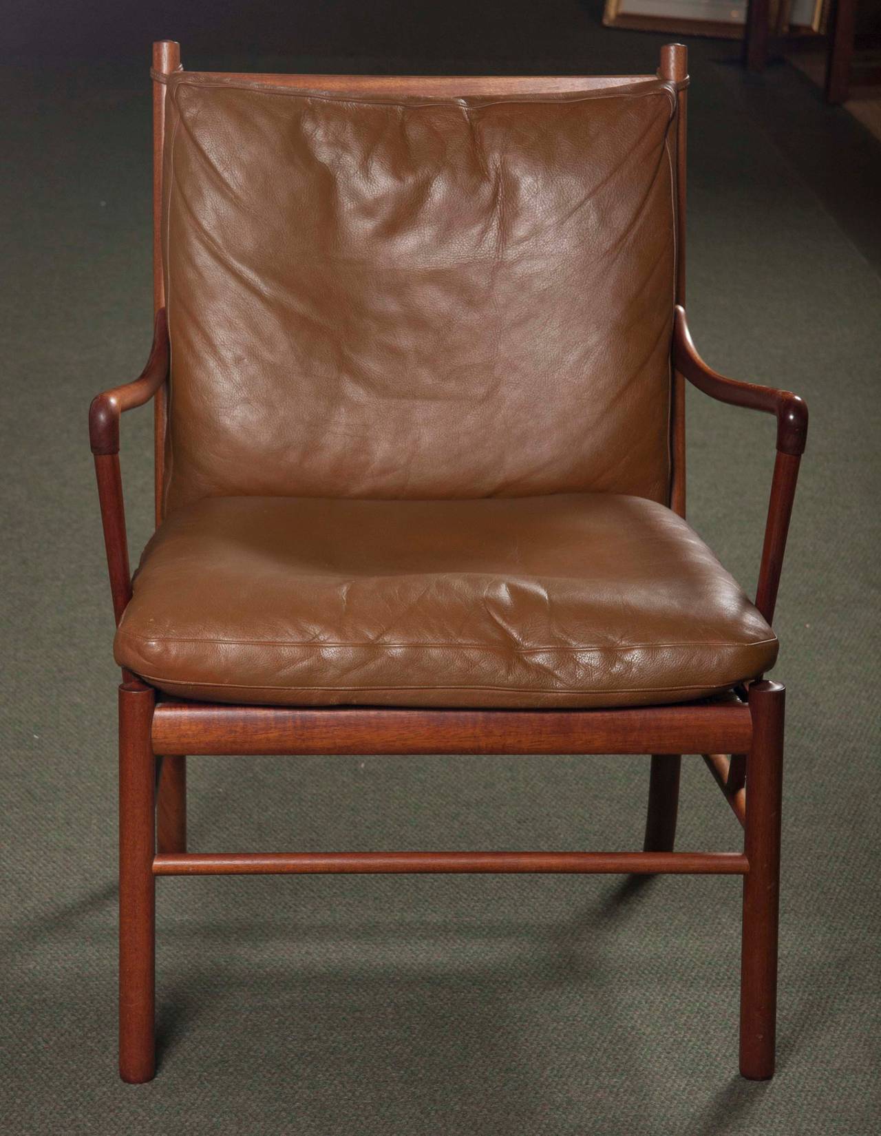 Ole Wanscher rosewood colonial chair OW/149 with peanut butter colored leather covered cushions; the under-seat of handwoven cane. Fine original condition. Dimensions: Seat height: 17.75.
