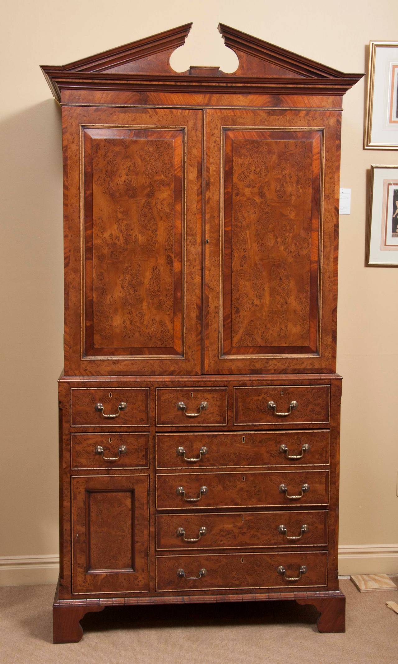 A late 19th century yew wood and figured mahogany linen press.