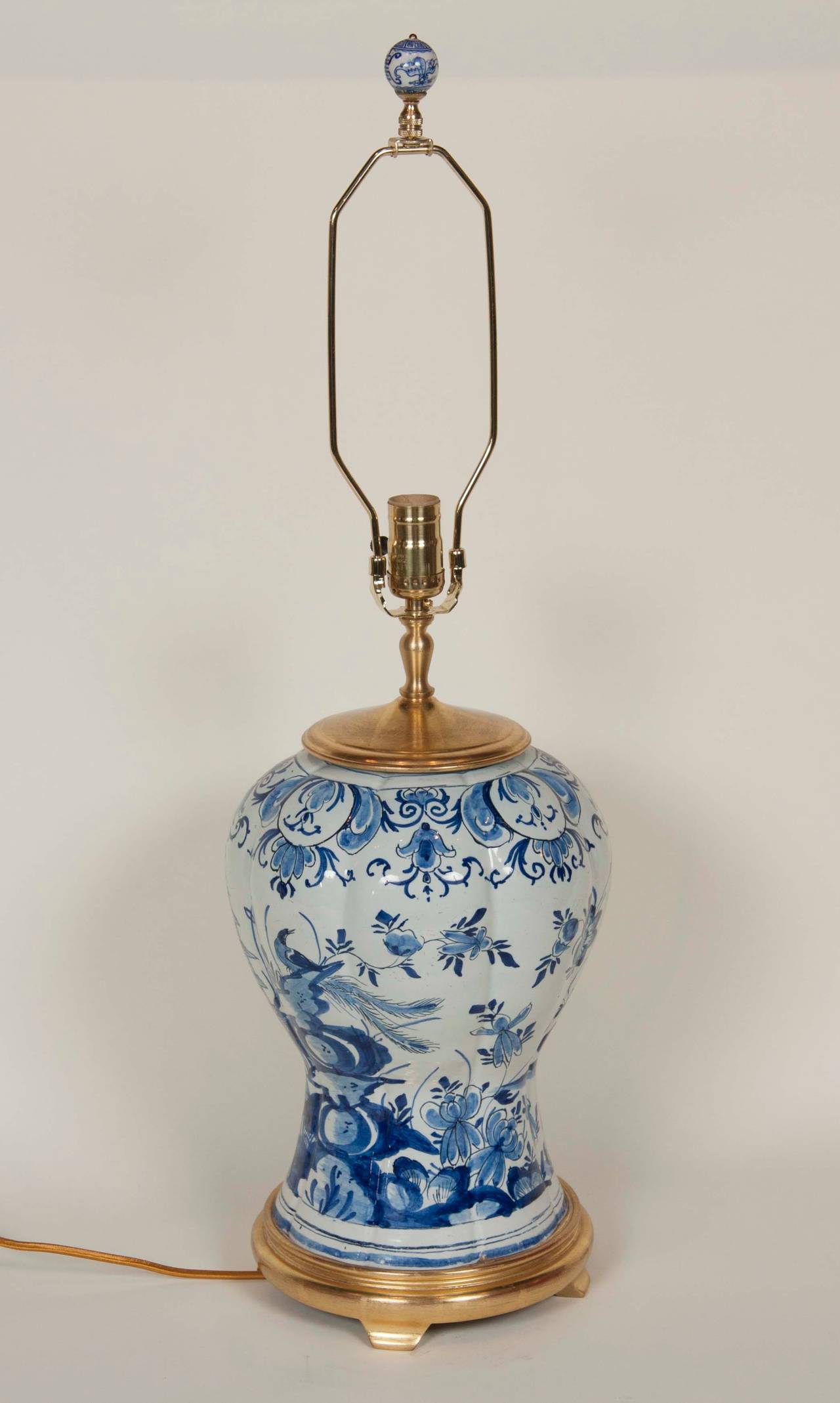 A blue & white 19th Century Delft vase now electrified as a lamp.
