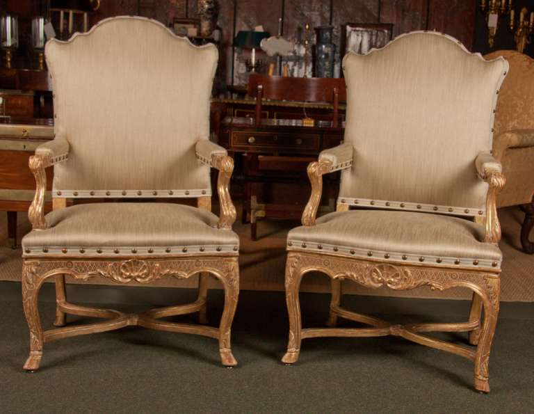 A pair of gilt Regency armchairs in beautiful upholstery.