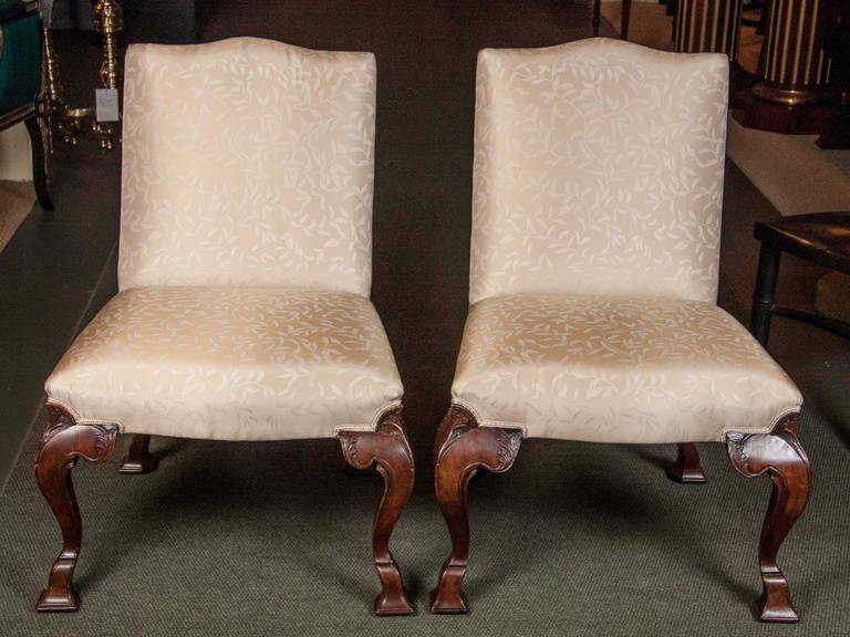 A wonderful set of eight walnut dining chairs. Six of the eight chairs date back to George II and the other two have been recently carved. Expected restorations and repairs.