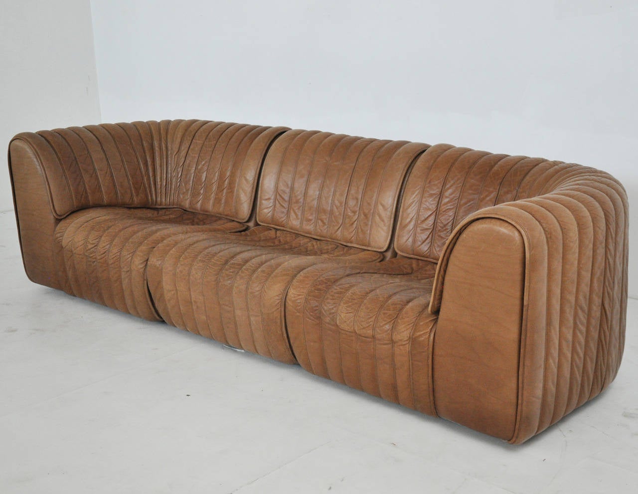 Natural brown leather sofa.  3 piece sectional.  Produced by De Sede in Switzerland and distributed by Stendig.  Rare model DS-22.