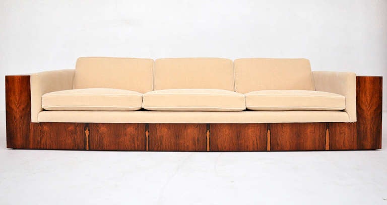 Oversized rosewood case sofa by Milo Baughman. Beautiful rosewood grain with extra wide case arms. Fully restored. Newly upholstered in champagne colored Belgian mohair. 21