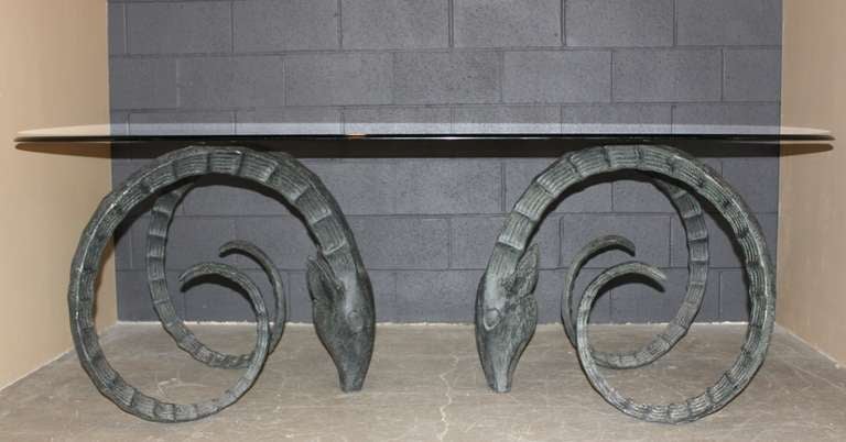 Fabulous Circa 1970's Ibex Rams Head metal with glass top table. Iron bases are a verdigris patina. Perfect for use as a dining table or desk. Great statement piece!