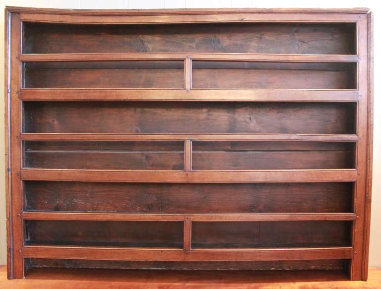 Fabulous French plate rack made from cherry or walnut. Has an amazing aged patina. Could be used in a variety of ways. Can be hung or set on top of a table or console. Very charming piece that will work in traditional or modern interiors.