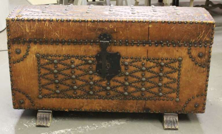 Fabulous Spanish trunk with original leather and studded decoration. A real personality piece. Has wonderful aged patina.