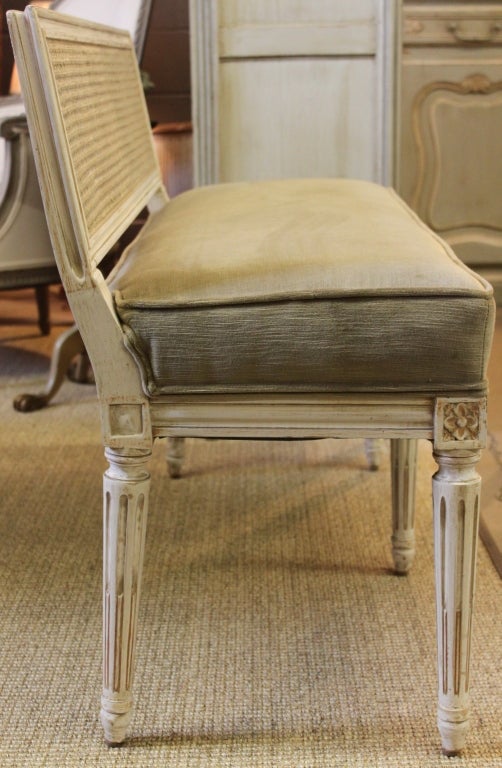 Lovely Mid Century French Style Cane Back Five Legged Bench Newly Upholstered with Taupe Cotton Velvet Fabric.