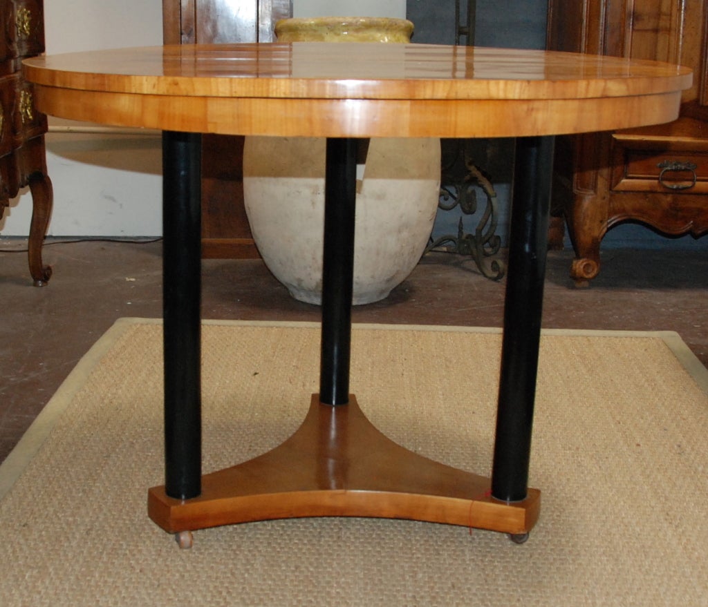 Beautiful Biedermeier Round Table from France. Birch wood top with black legs.