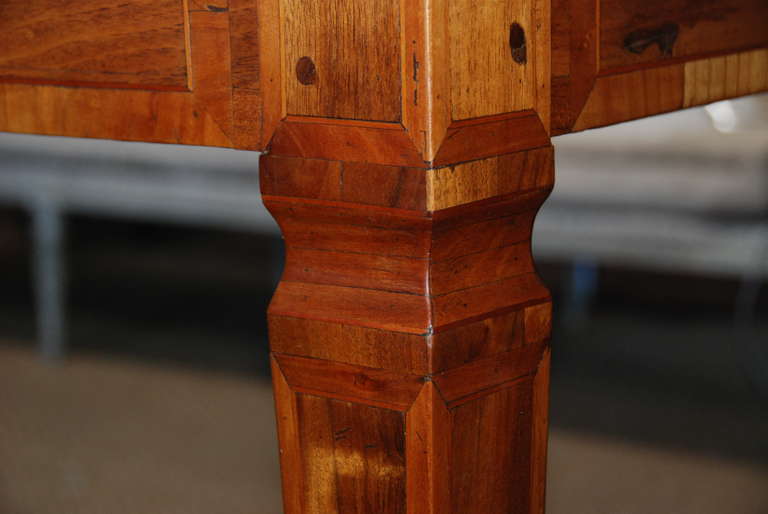 Beautiful French library table with patterns of walnut and cherry inlay.